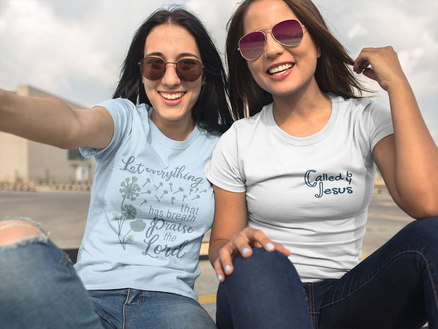 Two women wearing Christian graphic tees — “Let everything that has breath praise the Lord” and “Chosen by Jesus” designs by Eloise James Shop